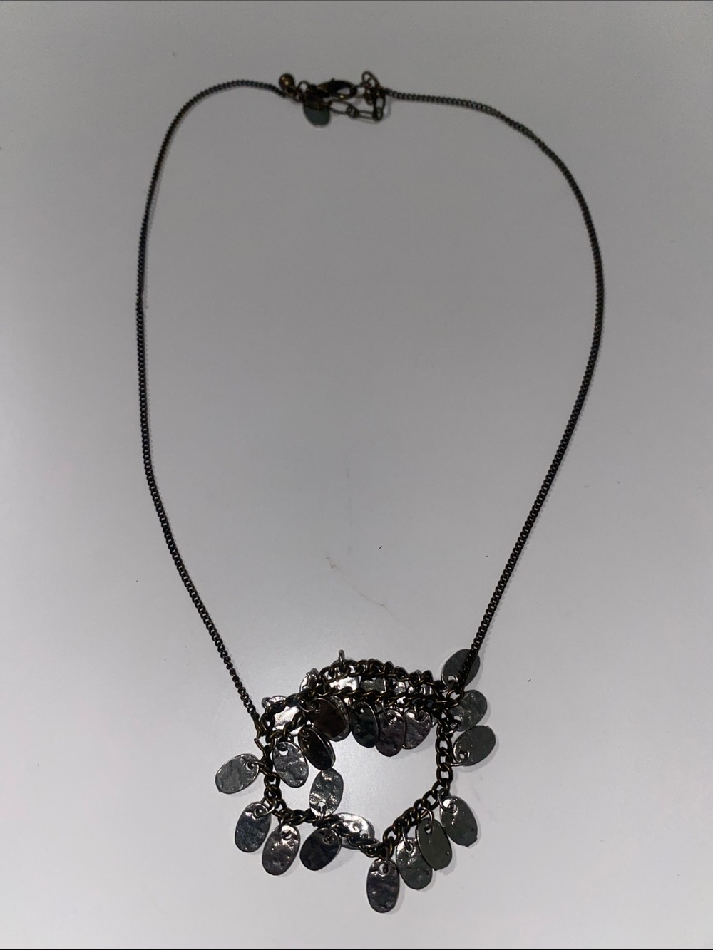 Silver Tone Dangle Charm Necklace with Textured Discs & Antique Brass